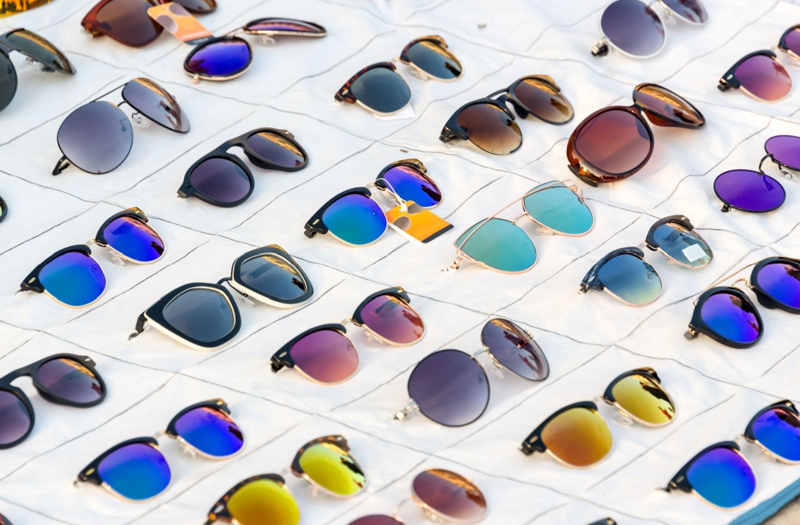 A display of sunglasses, showing both mirrored and non-mirrored options.